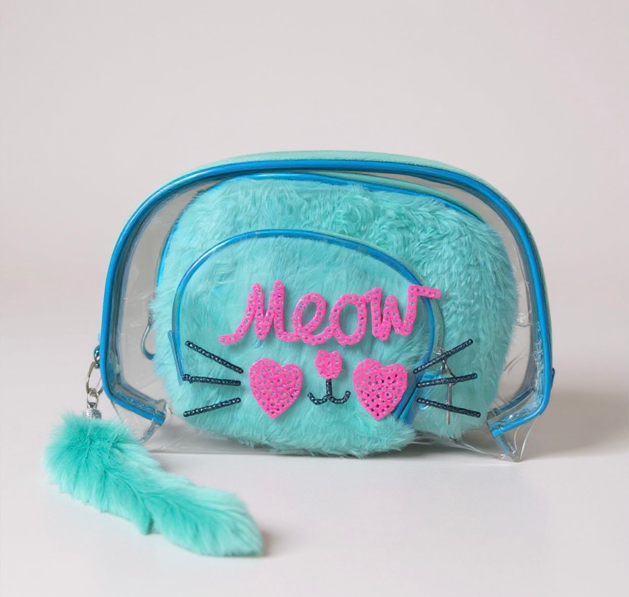 Turquoise plush bag with 'Meow' text and cat face design on a light gray background